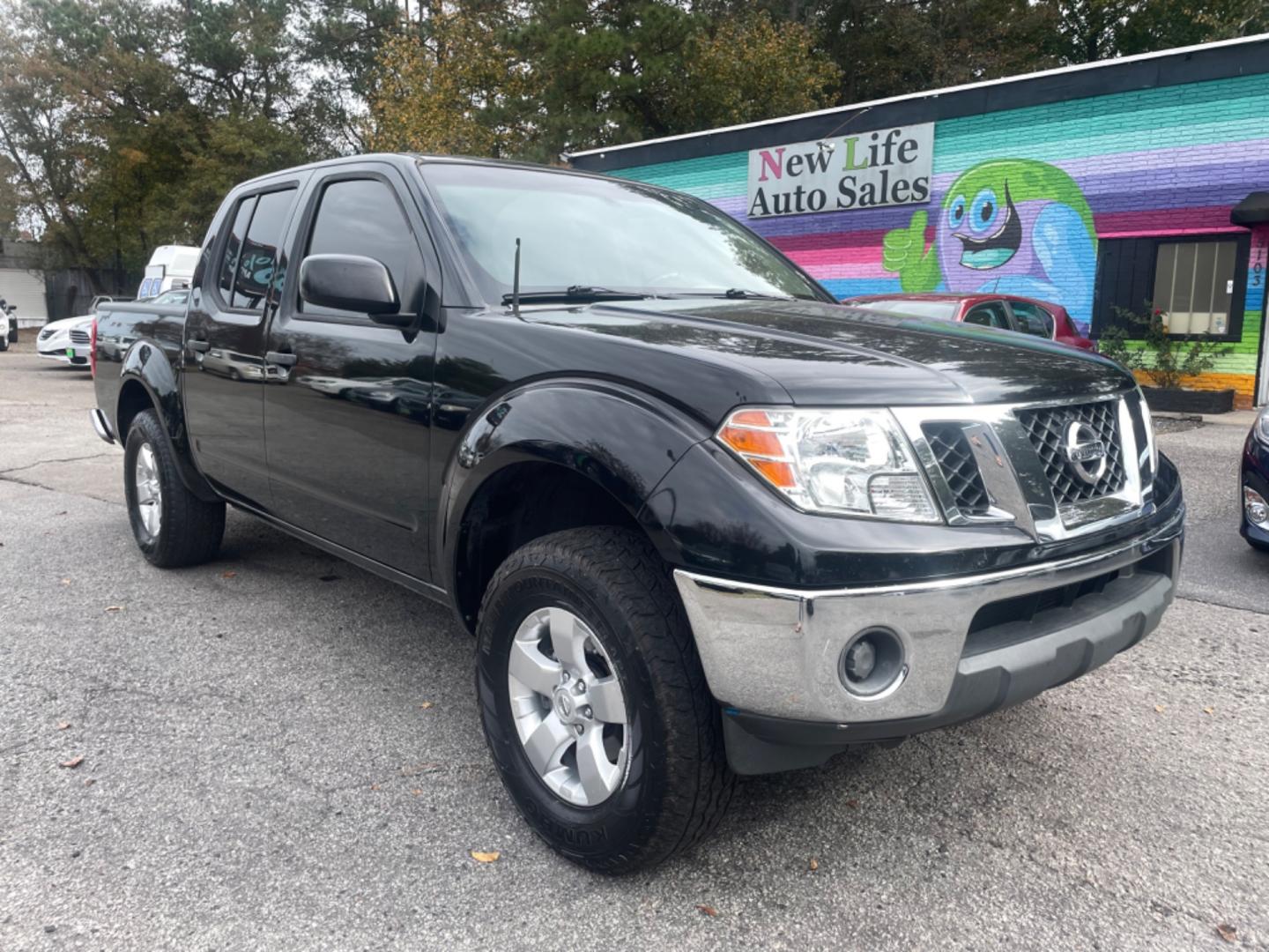 2009 BLACK NISSAN FRONTIER CREW CAB SE (1N6AD07U09C) with an 4.0L engine, Automatic transmission, located at 5103 Dorchester Rd., Charleston, SC, 29418-5607, (843) 767-1122, 36.245171, -115.228050 - Local Trade-in with CD/AUX/Bluetooth, Power Windows, Power Locks, Power Mirrors, Keyless Entry, Alloy Wheels, Bedliner, Tow Package. Clean CarFax (no accidents reported!) 209k miles Located at New Life Auto Sales! 2023 WINNER for Post & Courier's Charleston's Choice Pre-owned Car Dealer AND 2018-2 - Photo#0